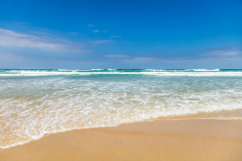 the ocean is very blue with green water