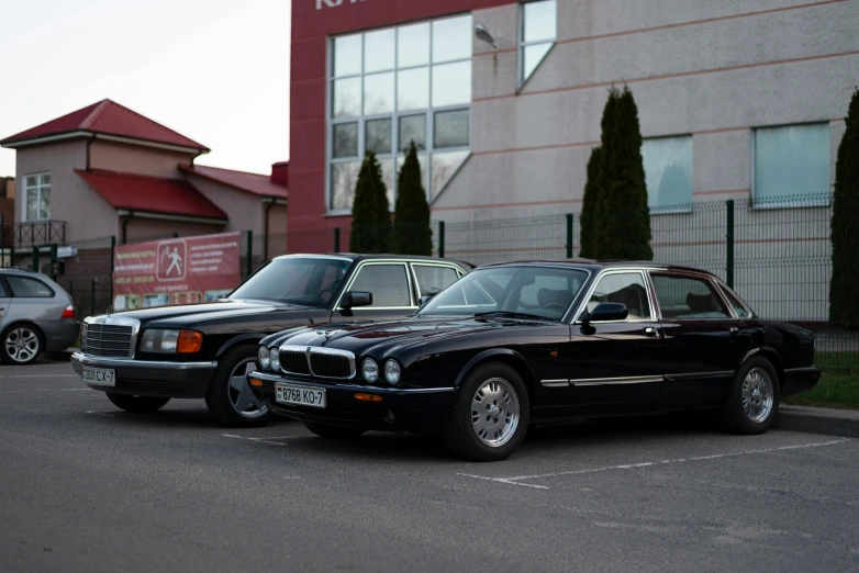 a couple of cars that are parked in the lot