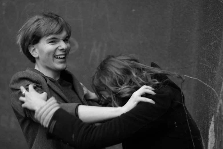 two young women having fun hugging each other