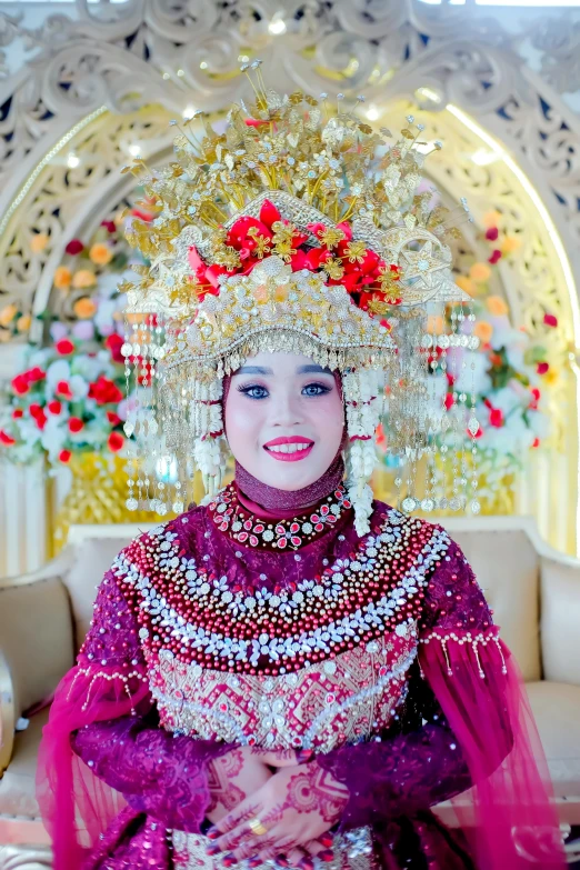 the girl is in traditional dress and a flower headdress