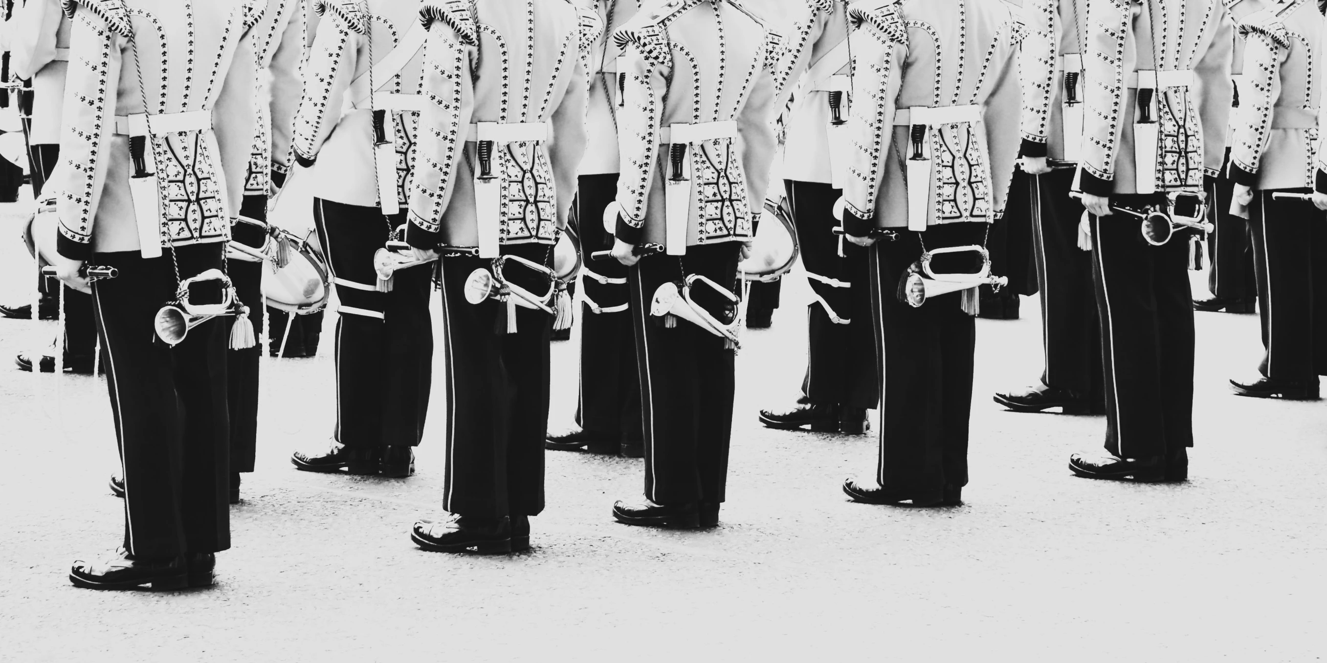 a group of men standing next to each other in uniform