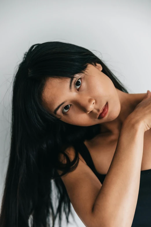 young woman in black shirt posing for camera