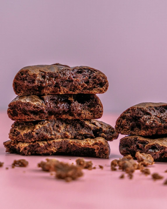 chocolate cookies are piled high on top of each other