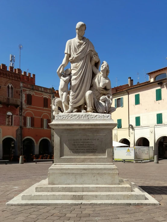 a statue of an individual with two children