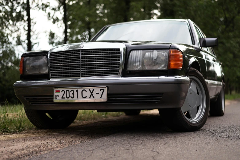 a mercedes benz is parked on a street