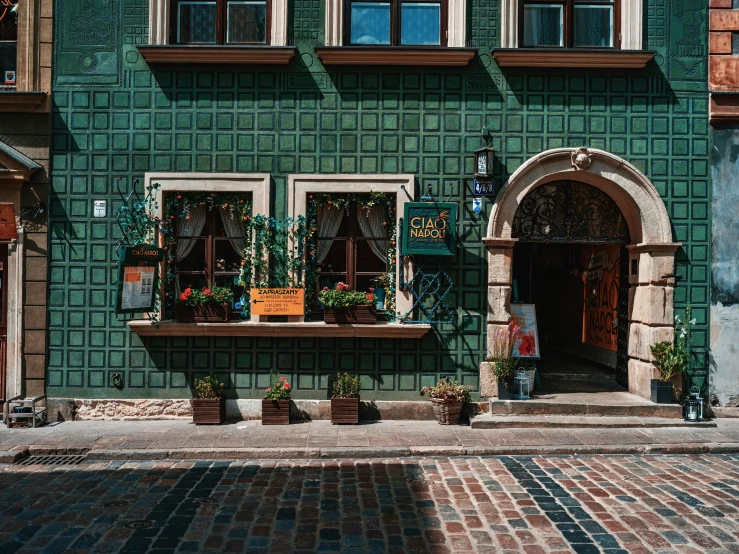 a building that has some plants on the window