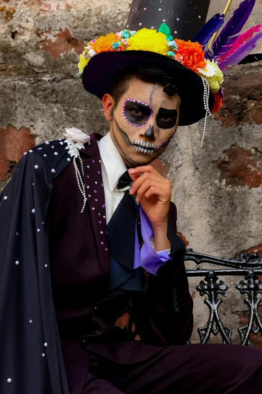 a man in day of the dead attire and colorful hair
