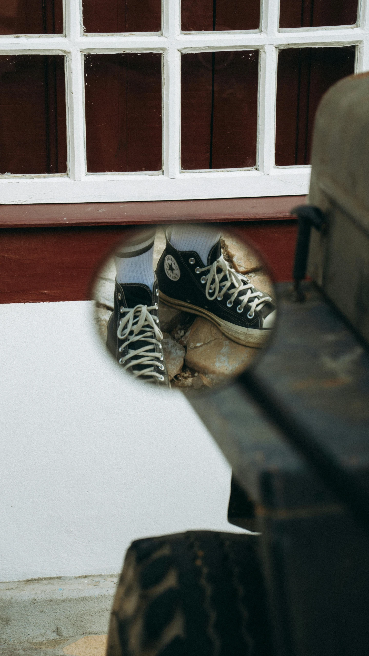 a suitcase and some shoes sitting by a door