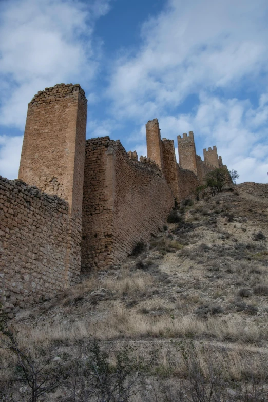 old ruin on a hill with a sky background