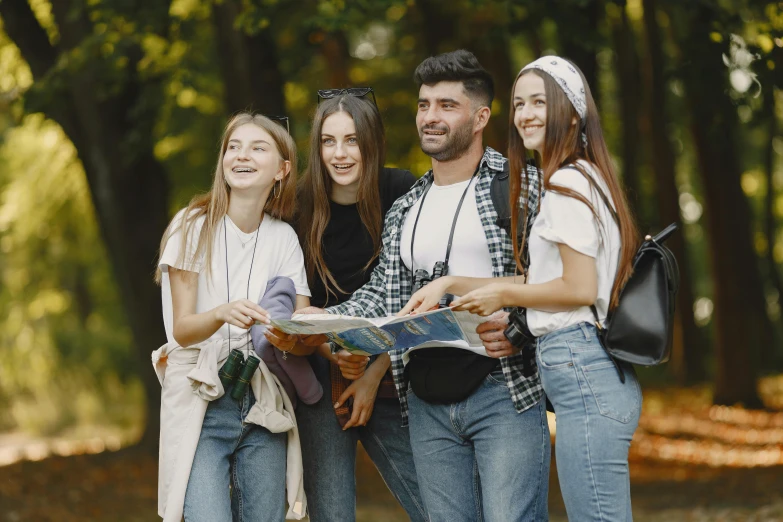 four young people posing for the camera