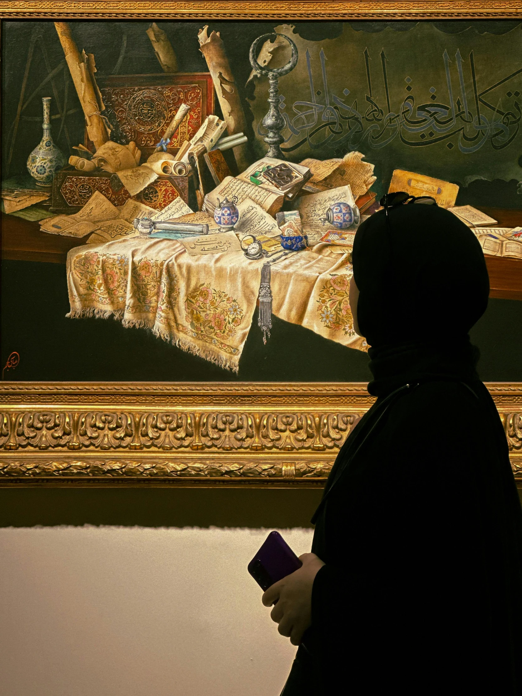 a person is looking at some artwork in a museum