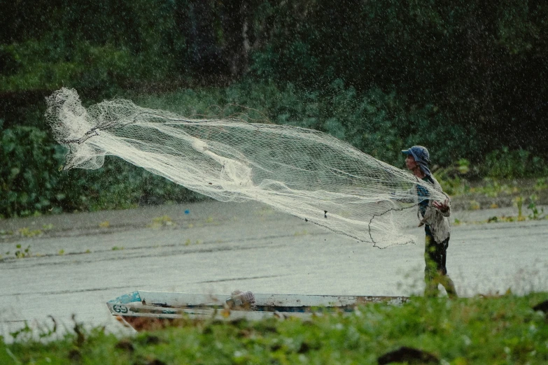 a man on the shore throwing water onto his body