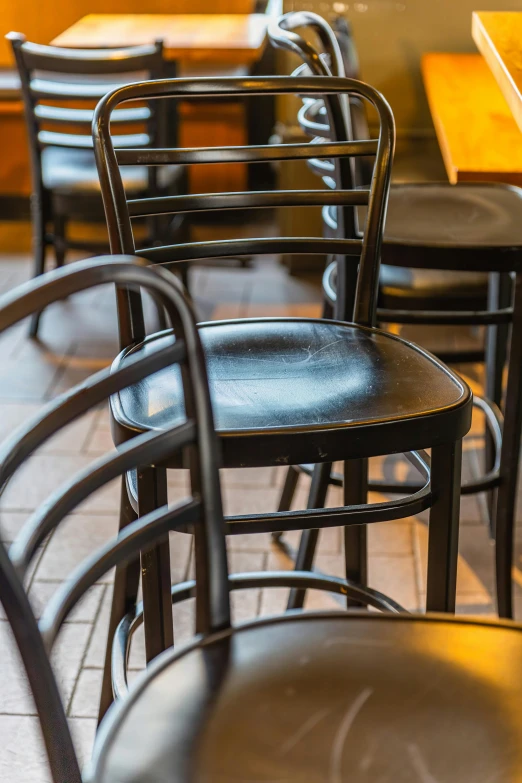 an empty restaurant table with metal chairs