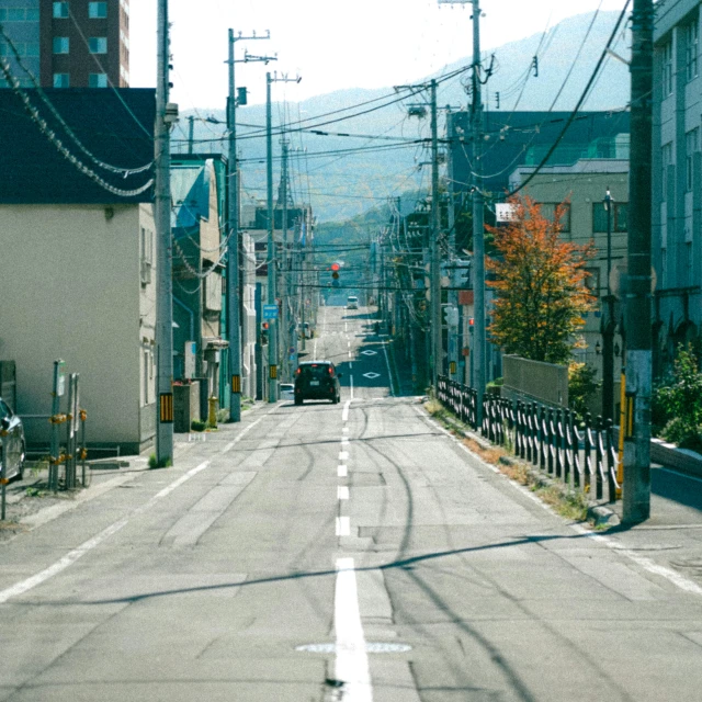 a small town in the mountains has buildings, and street lights