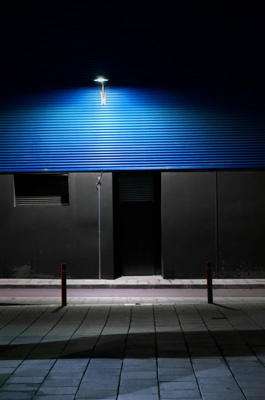 the front of a building lit up with street lights