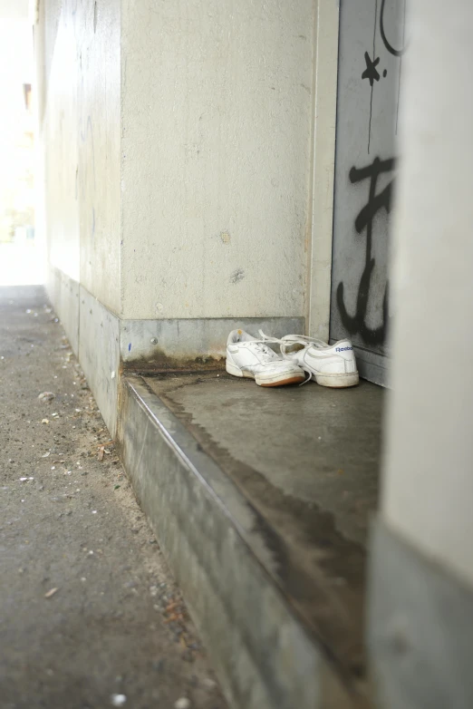 the shoes are lined up in front of a door