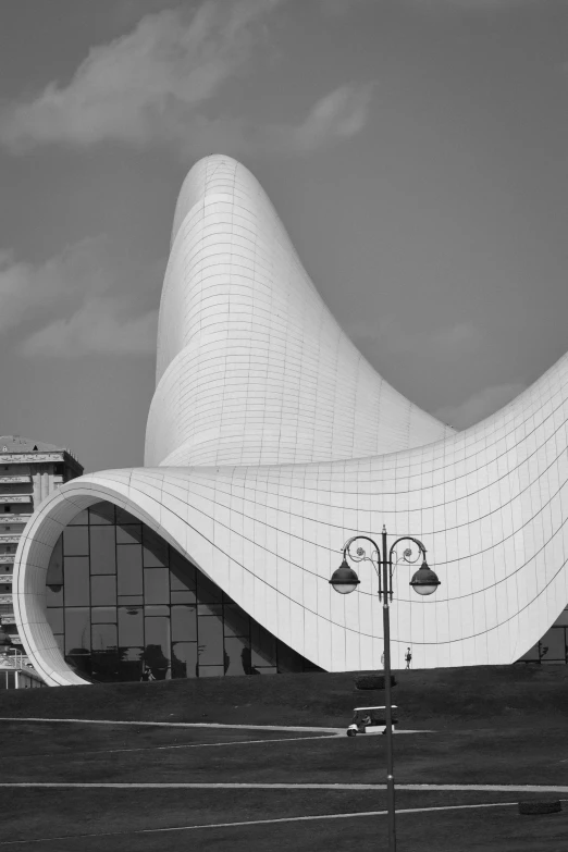 a large white building with a long pointy roof