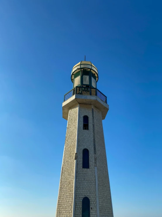 an image of a lighthouse that is in the day time