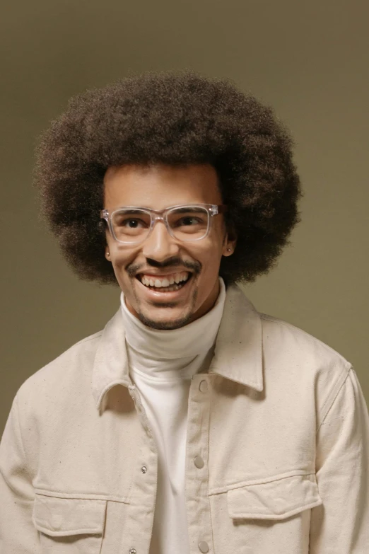 a man wearing a collared shirt and a turtle neck scarf