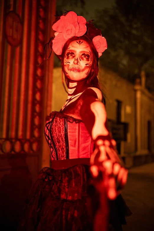 a woman in a skeleton makeup for halloween