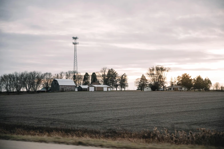 a lonely building sits in a large field