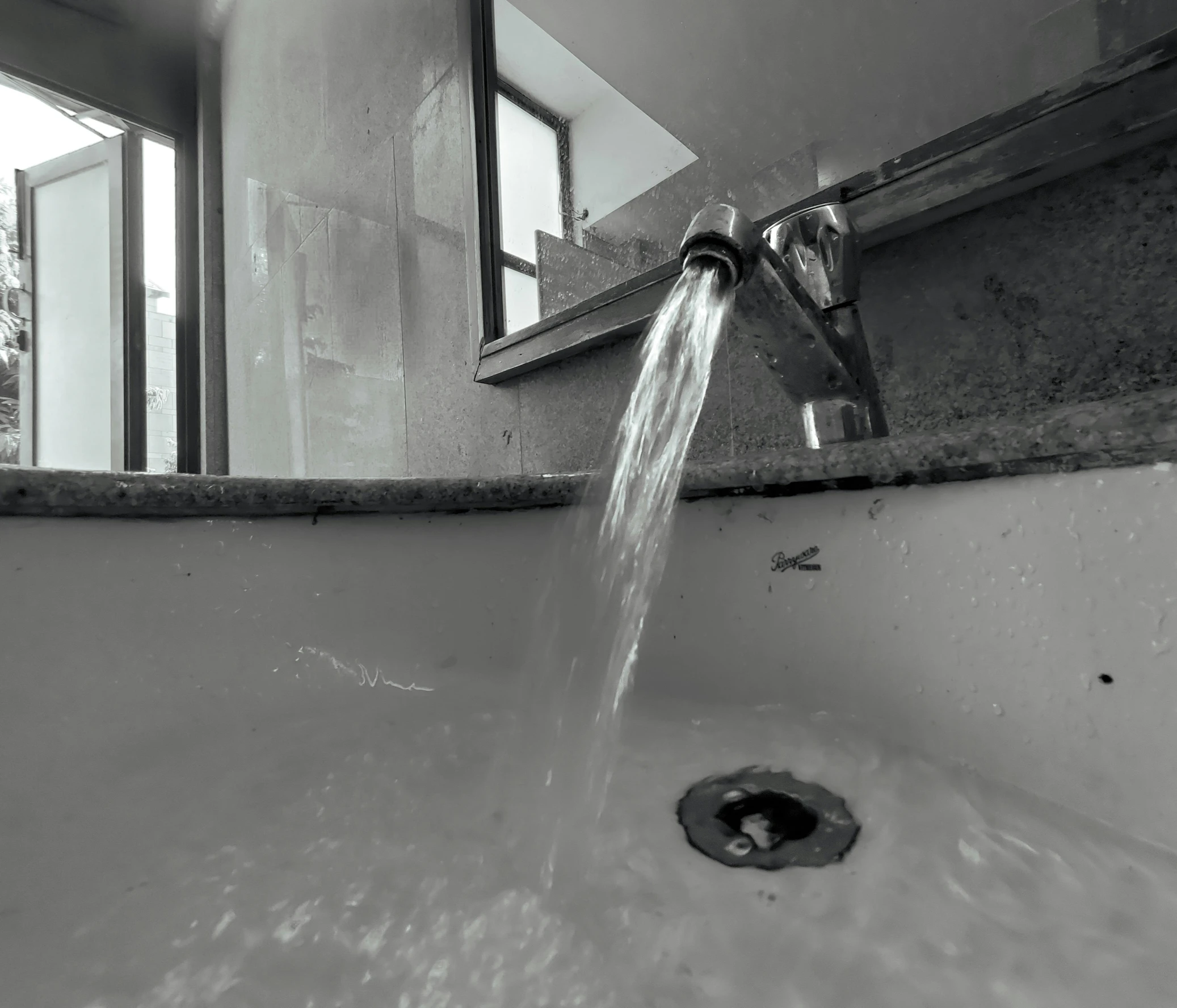 a faucet running from a faucet in the bathroom