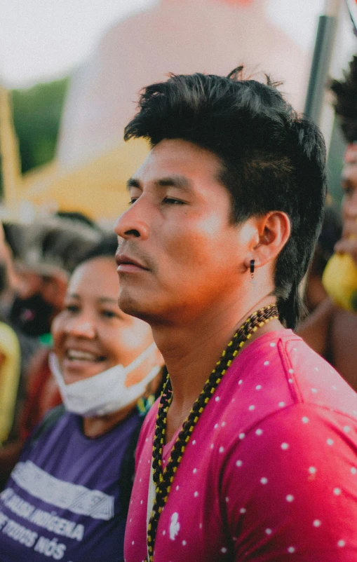 a man wearing a string attached to his nose