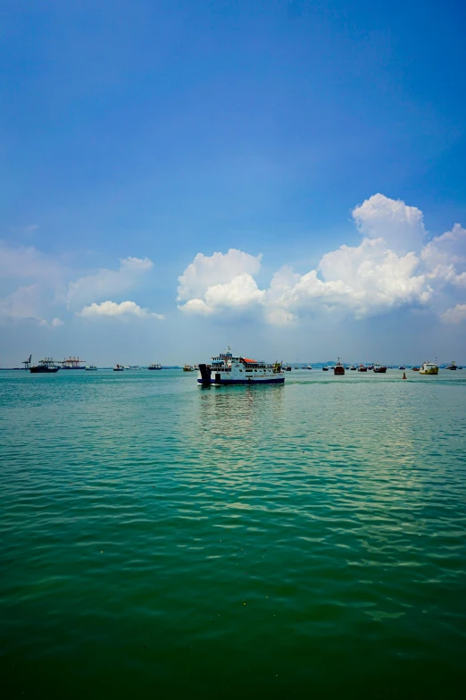 a lone boat on a wide expanse of water