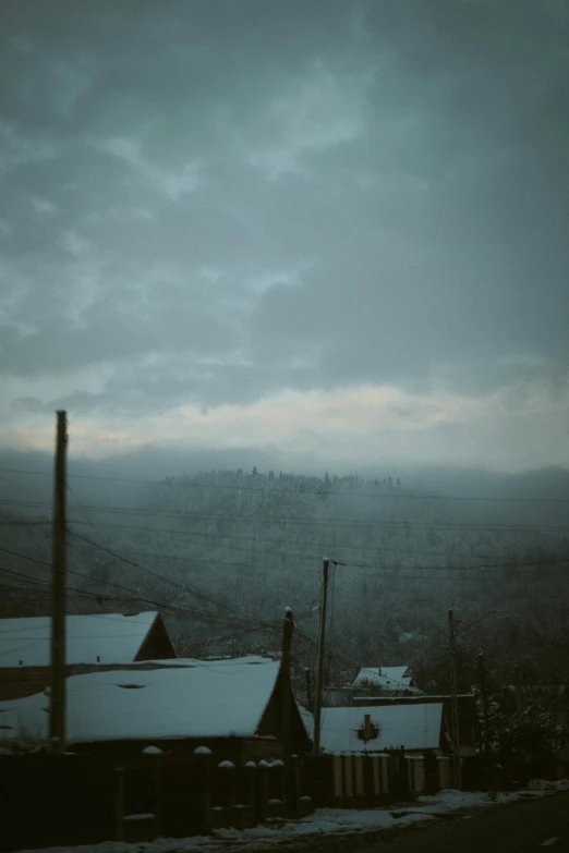 a very old factory with a cloudy sky