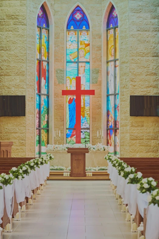 flowers are laid out on benches along side a church pew