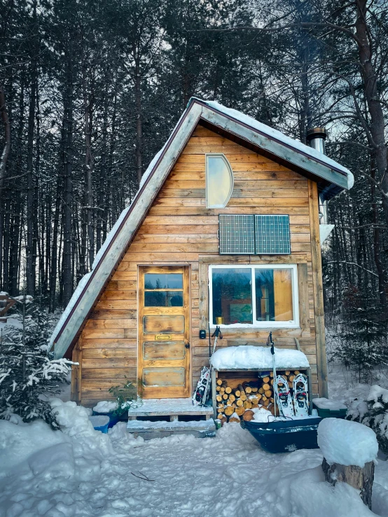 a cabin in the woods in wintertime