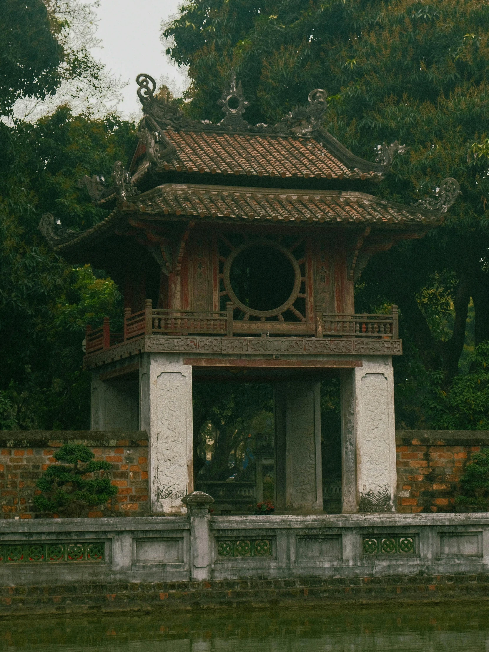 the pavilion is next to the small pond