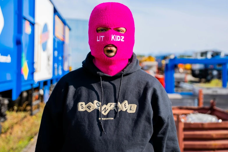 a person wearing a pink mask on their face