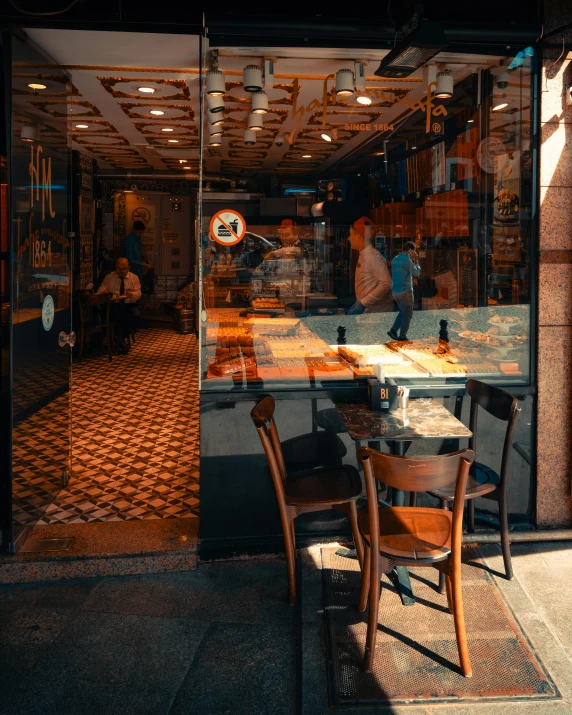 a store is reflected in the glass door of the building