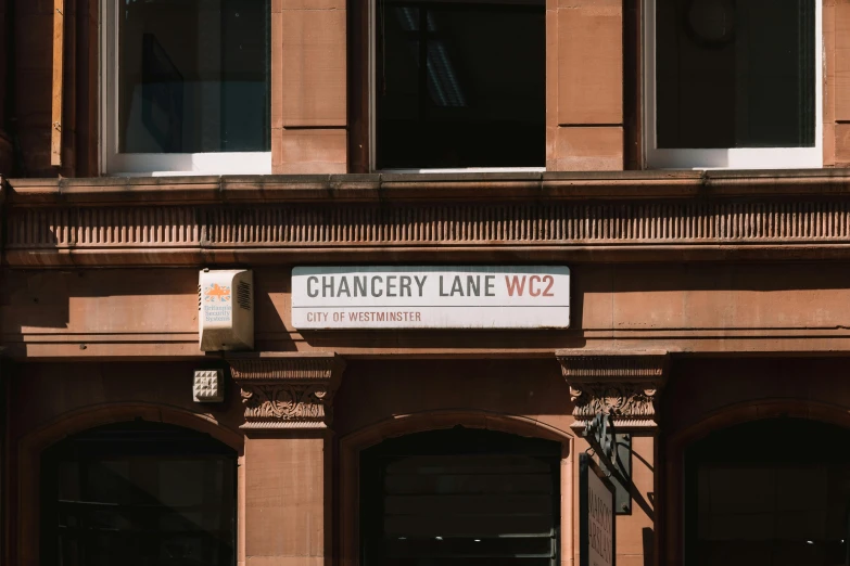 a street sign on the corner of an old building