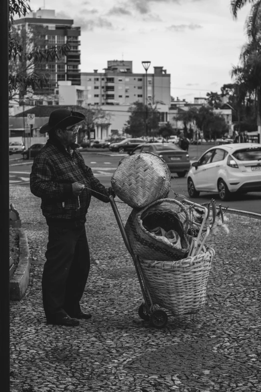 a man is holding a basket full of bread