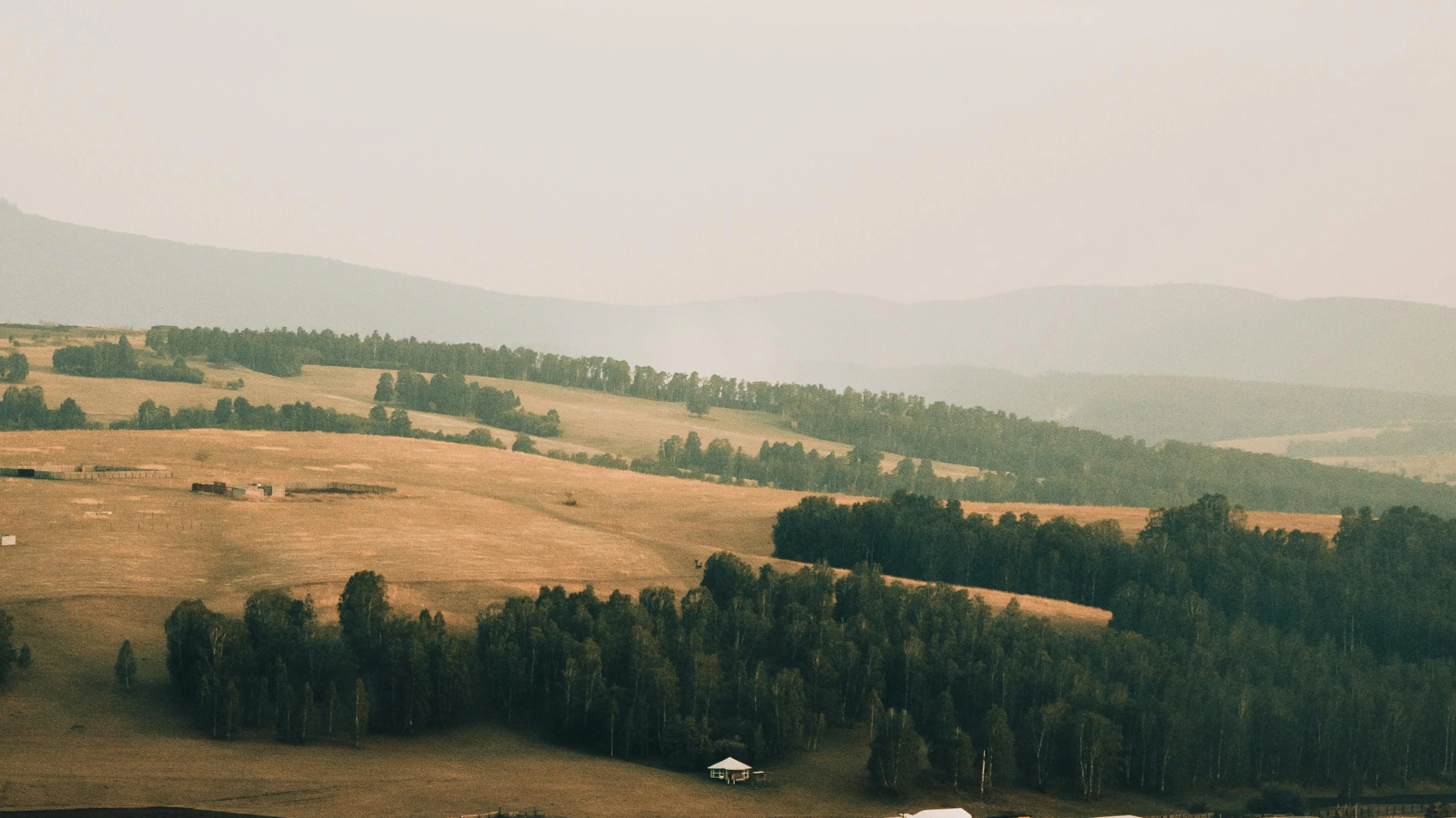 a landscape view with the countryside and trees