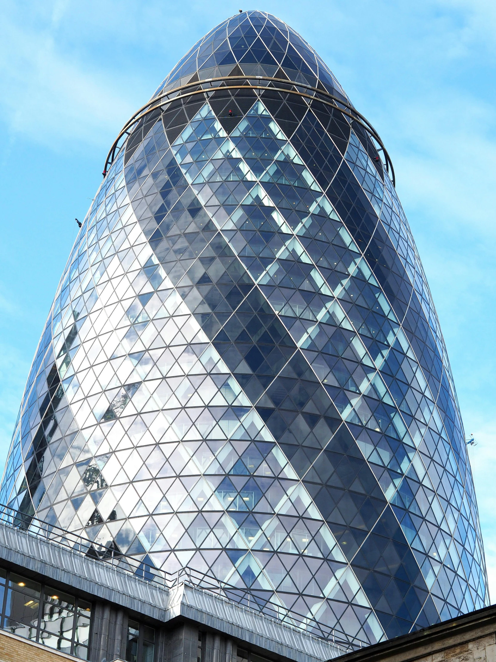 a big building that has a very large blue glass in it