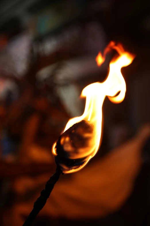 fire coming from a small stick in the air