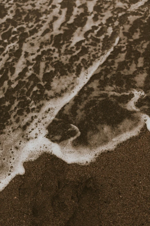 the ocean water waves on the sandy beach