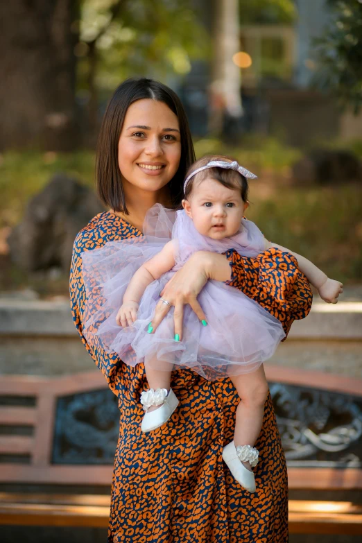 a woman holding a baby on her back