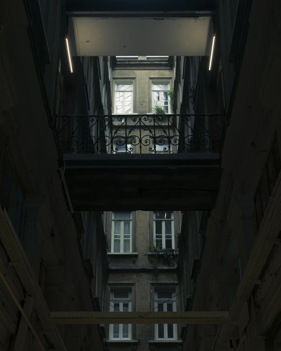 inside an empty building with a few windows and balconies