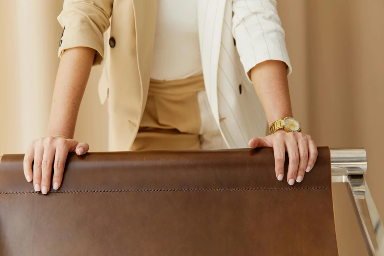 a close up of a person holding a luggage