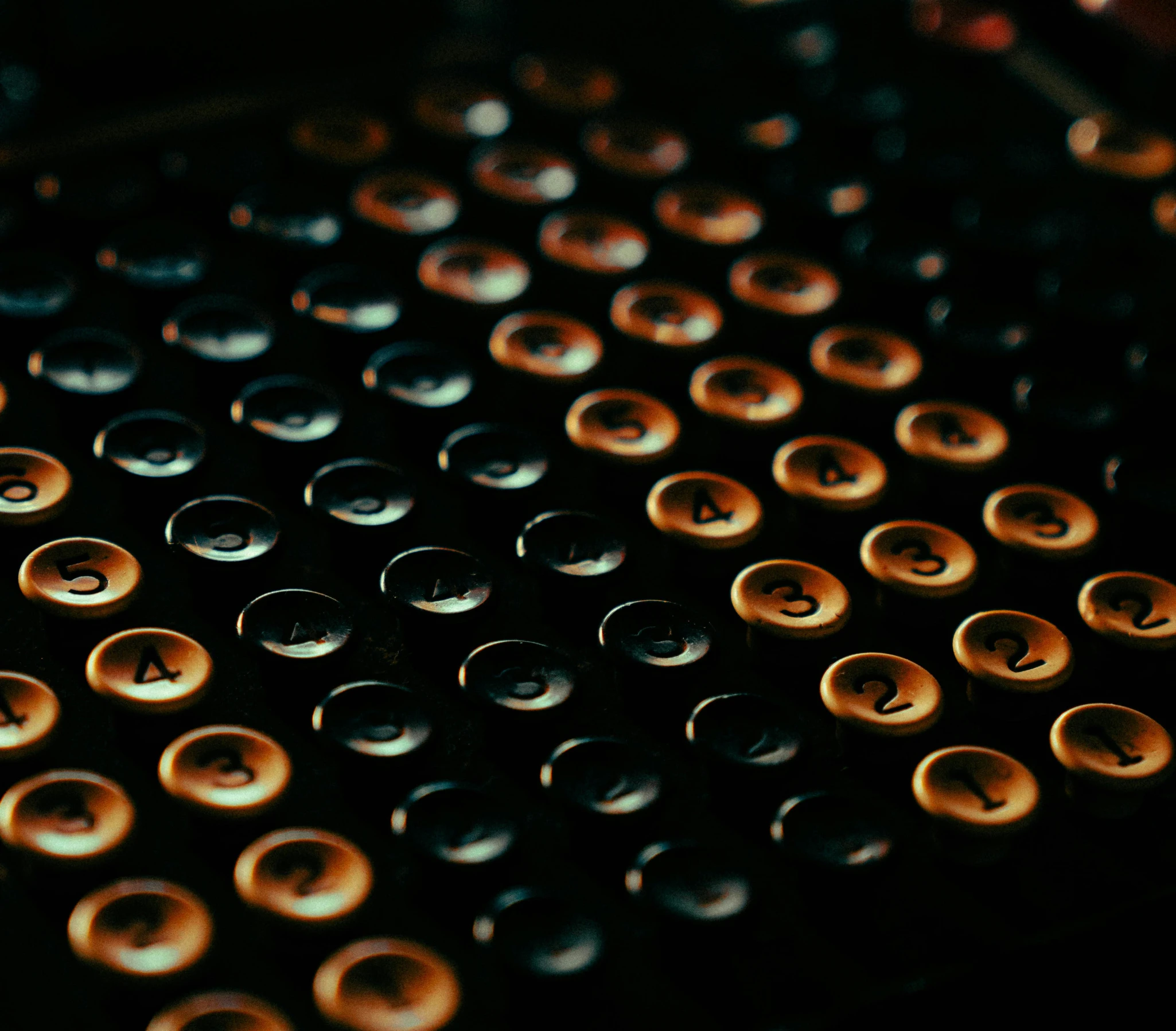 water droplets on black surface with orange highlights