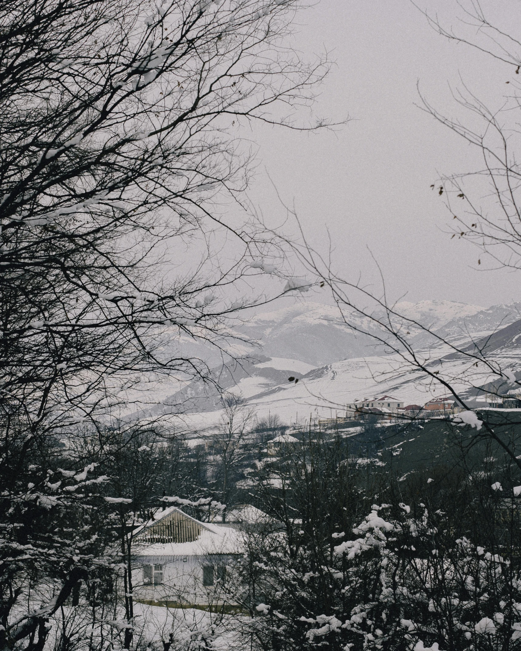 the snow is covering the landscape and mountains