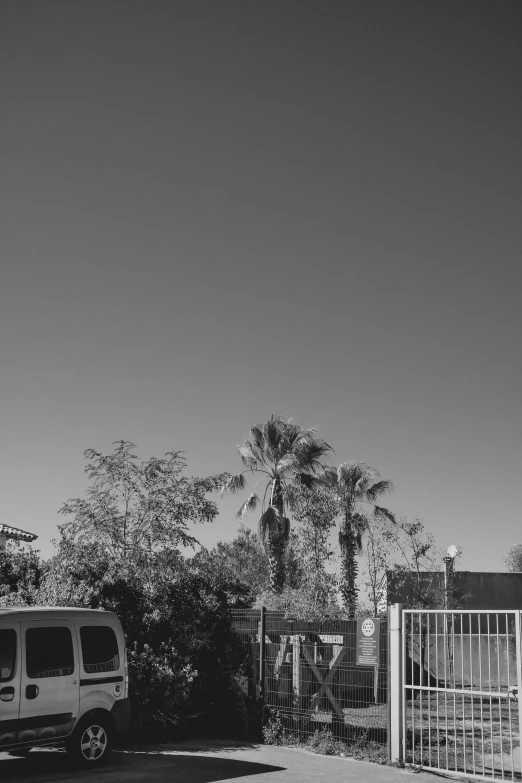 a big white truck driving on top of a dirt field