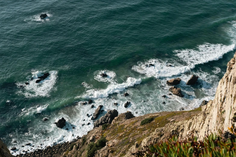 a rocky coastline on the top of a hill