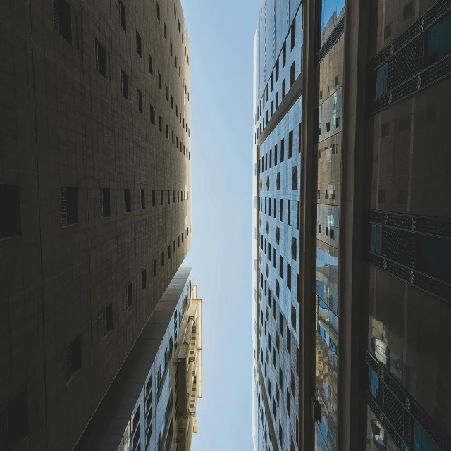 the view of tall buildings from below