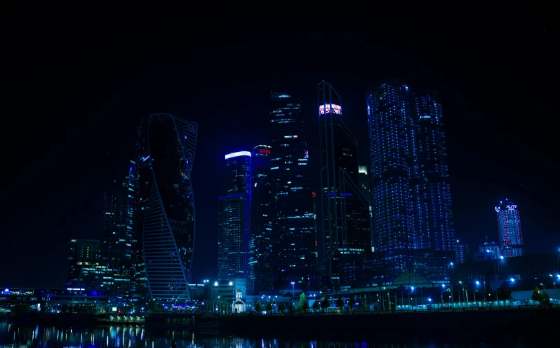 night time image of a cityscape with lights and reflections