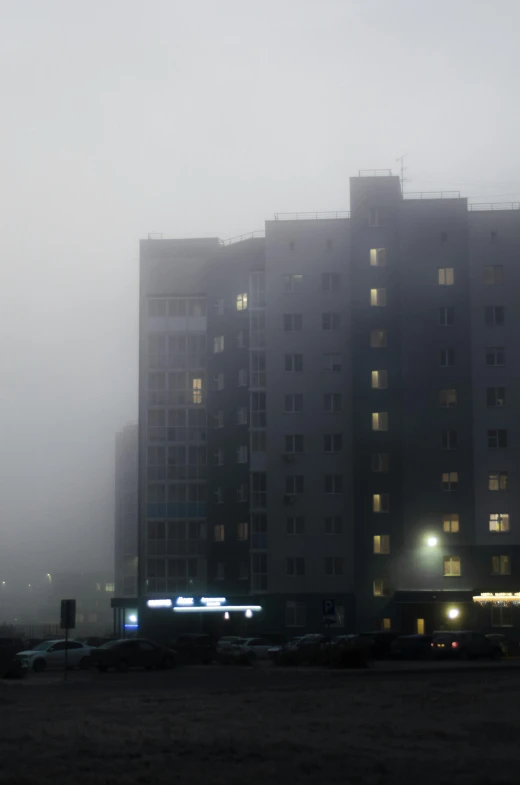 an image of foggy night in a city setting